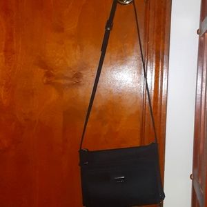 Black purse, multiple zipper storage with cell phone holder